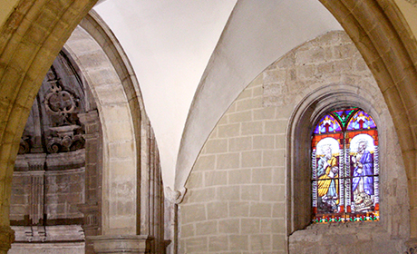 Stained glass window and arch in gothic area